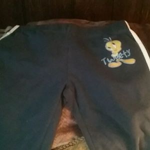 Blue pants with tweety bird, stripes down sides
